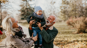 Grandparents holding grandson